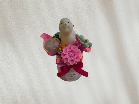 Small Easter scented candle flower arrangement