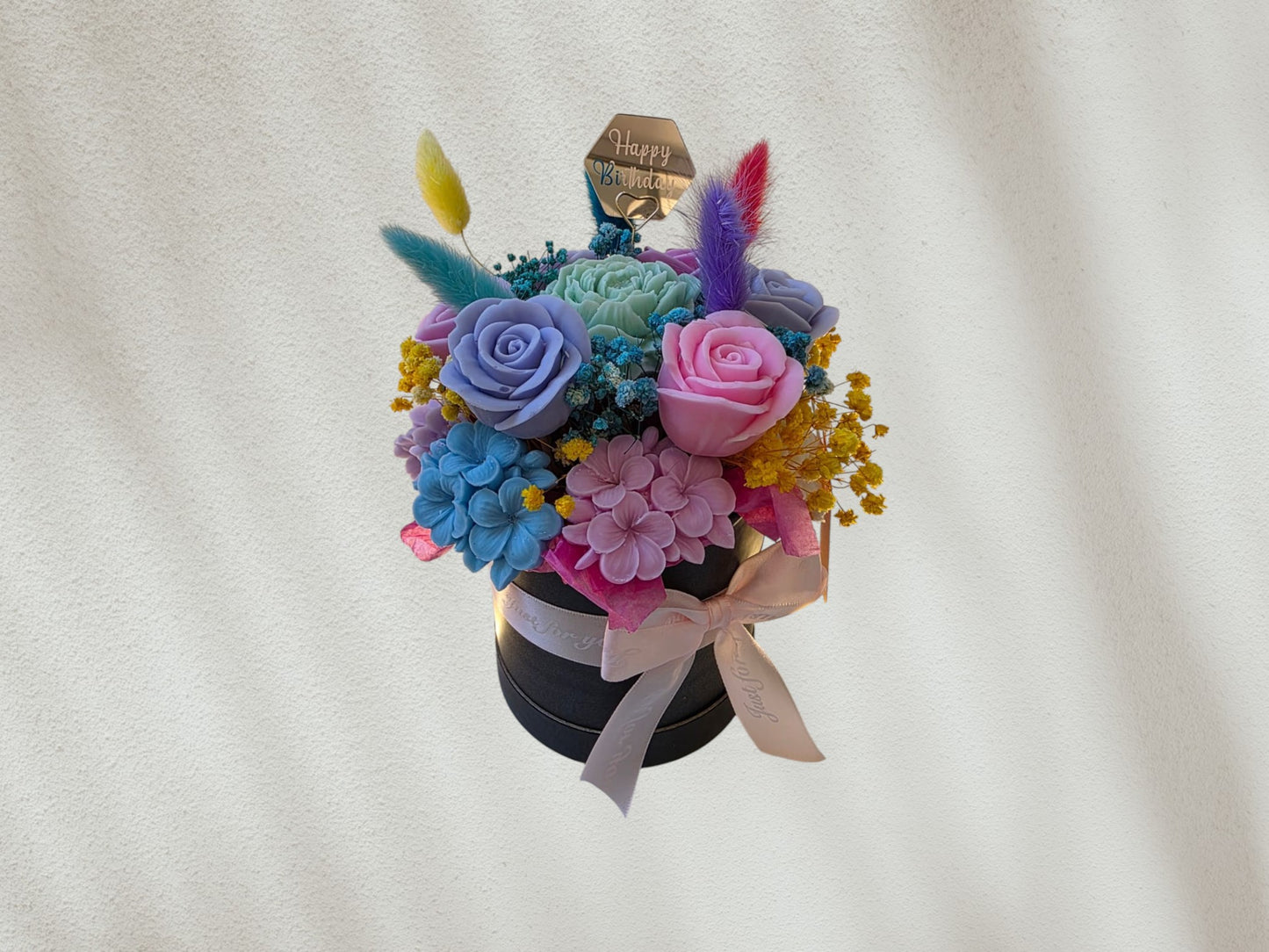 Flower arrangement in a box with ribbon