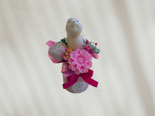 Small Easter scented candle flower arrangement
