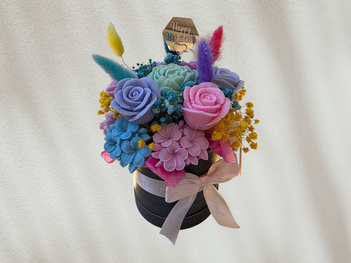 Flower arrangement in a box with ribbon